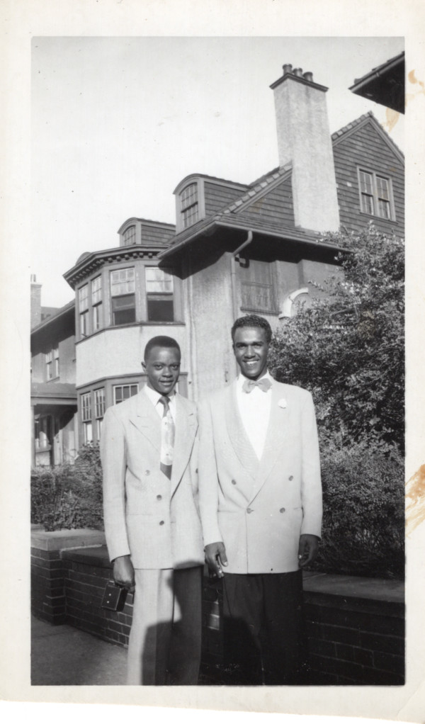 Two well-dressed men in front of house by Unknown