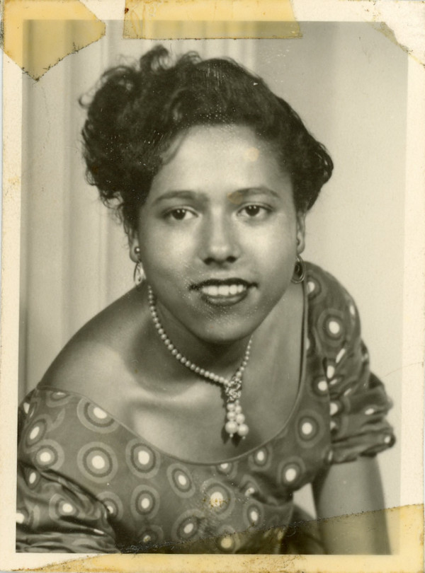 Woman with pearl drop necklace by Unknown