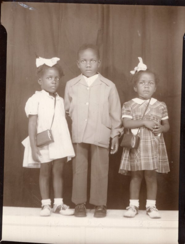Two girls and a boy by Unknown