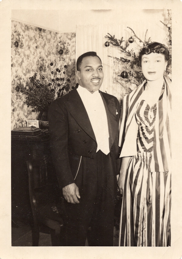 Formally dressed couple at Christmas by Unknown