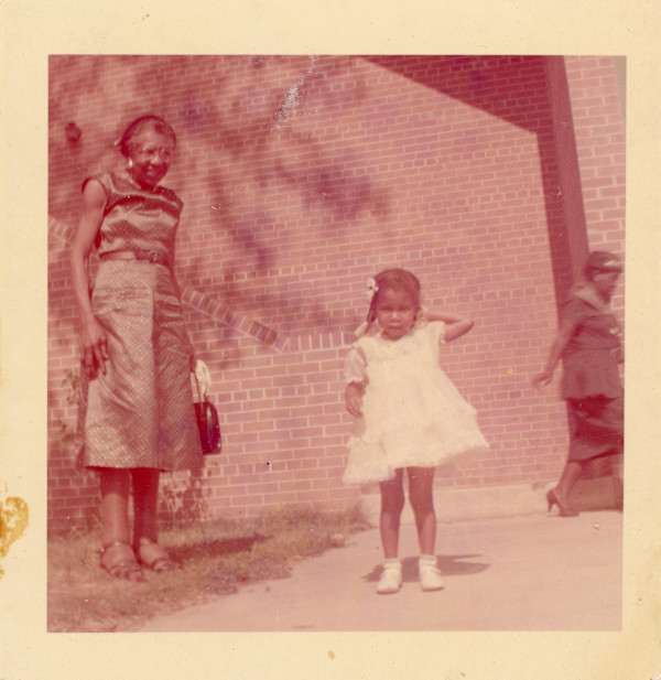 Woman in green satin dress and young girl by Unknown