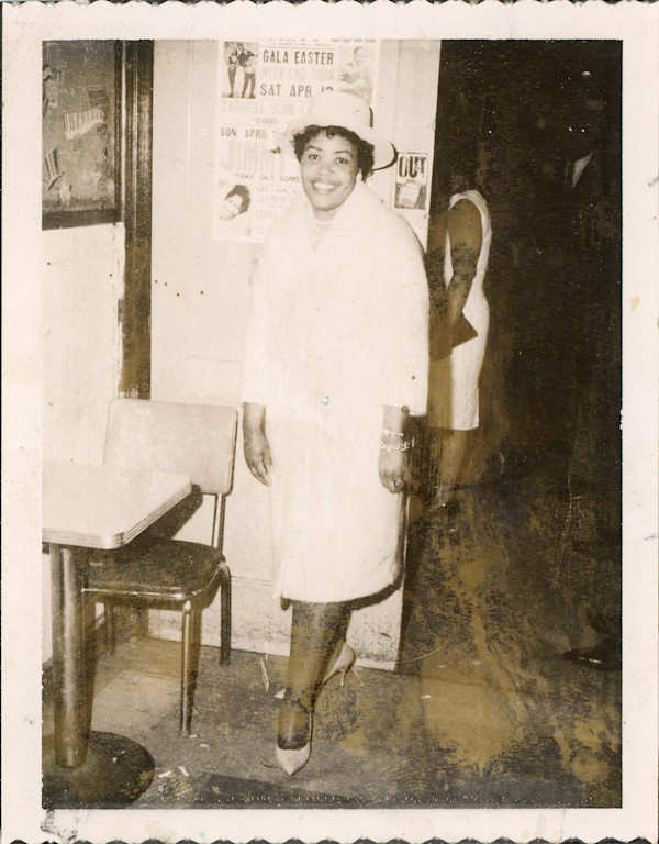 Woman posing in front of Easter gala poster by Unknown
