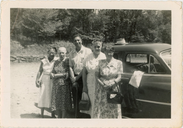 Four women and one man by Unknown