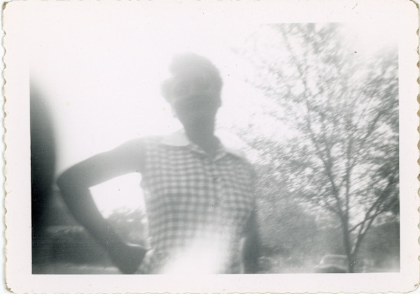 Woman in checkered dress by Unknown