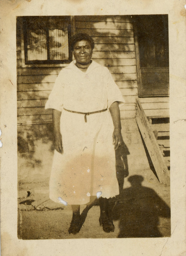Woman in light dress with photographer’s shadow by Unknown