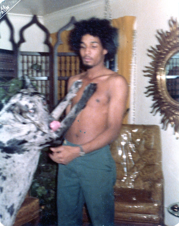 Man with black & grey dog by Unknown