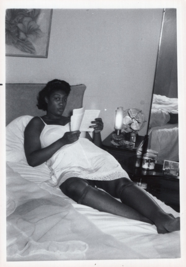 Woman reclining in bed, reading, Carlisle, Pennsylvania by Unknown