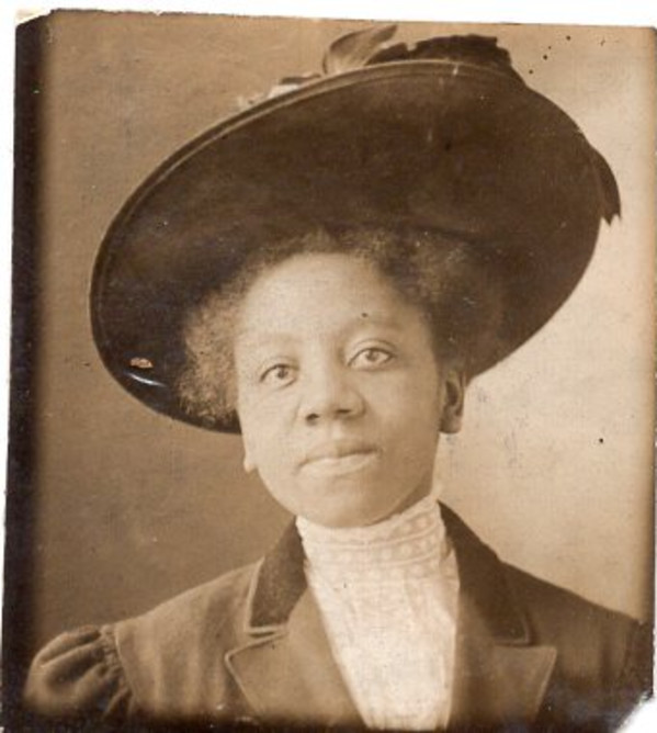 Gem miniature of woman in high-necked lace blouse and hat by Unknown