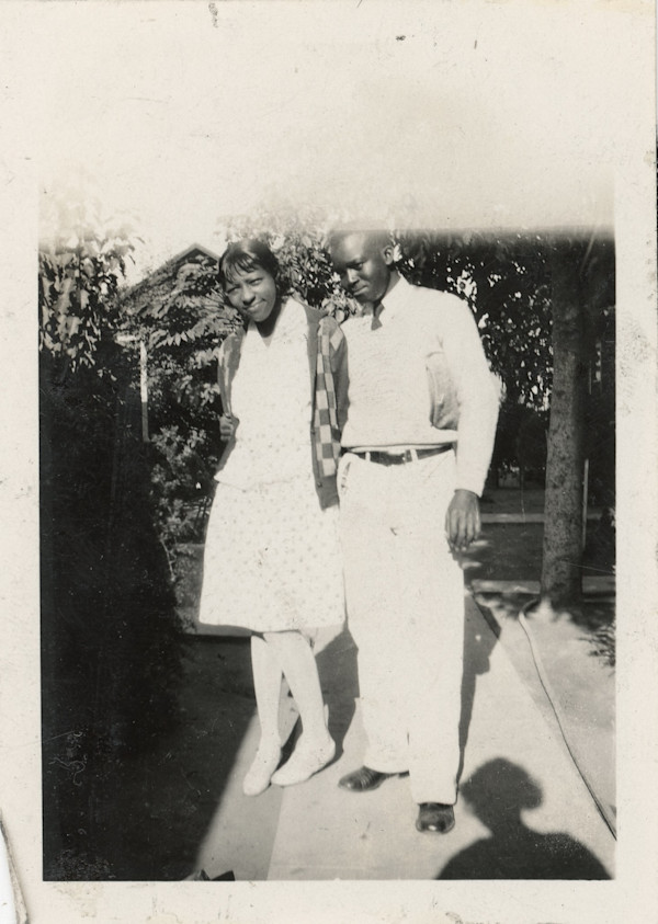Couple with photographer’s shadow by Unknown
