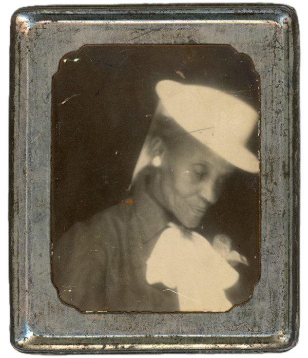 Older woman in metal Photomatic frame by Unknown