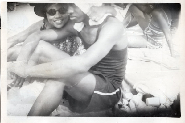 Young couple on the beach by Unknown
