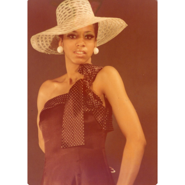 Woman in large brim hat by Unknown