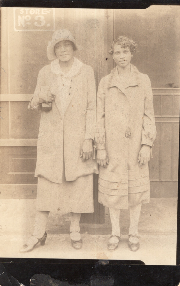 Two women in front of Store No. 3 by Unknown