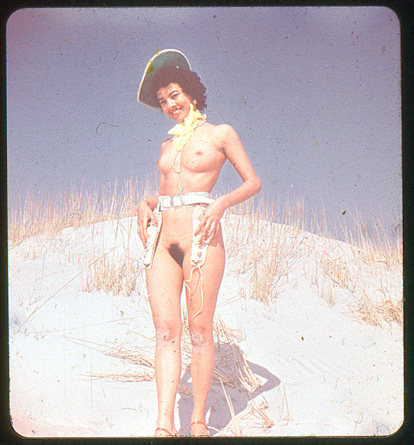 Pinup #109 wearing holster and hat by Unknown