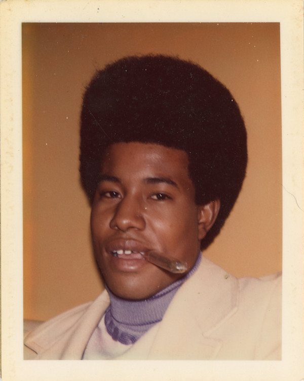 Young man with plastic-wrapped cigar by Unknown