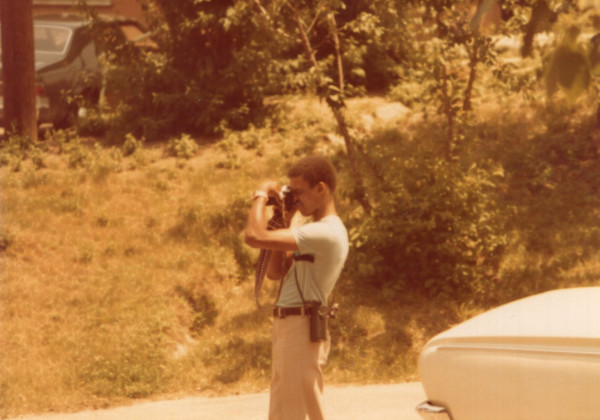 Man photographing by Unknown