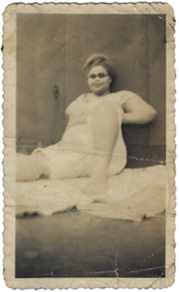 Relaxed woman in sunglasses by Unknown