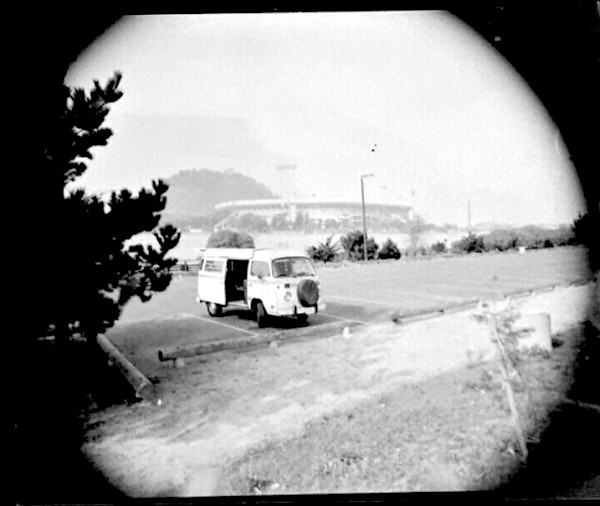 VW van in Giants Stadium parking lot, San Francisco by Unknown