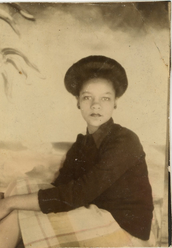 Woman sitting sideways by Unknown