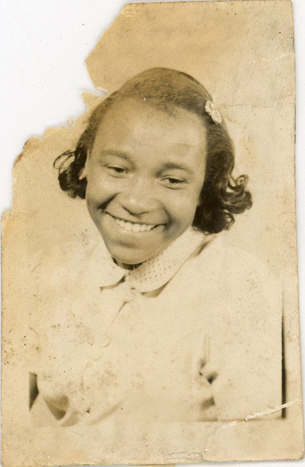 Smiling girl with barette by Unknown
