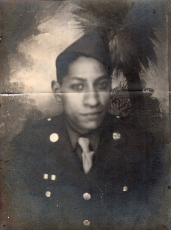 Young soldier with palm backdrop by Unknown