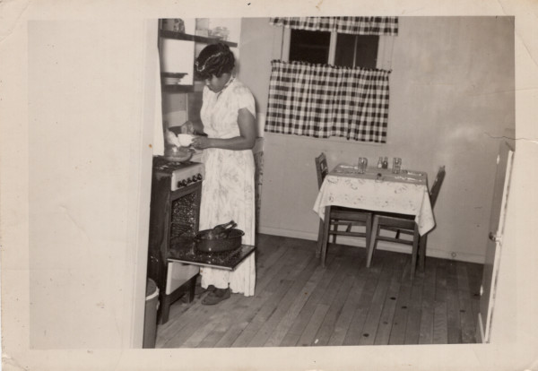 Woman at the stove by Unknown