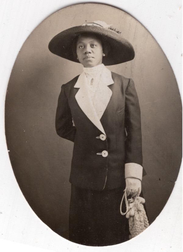 Woman in dark suit by Unknown