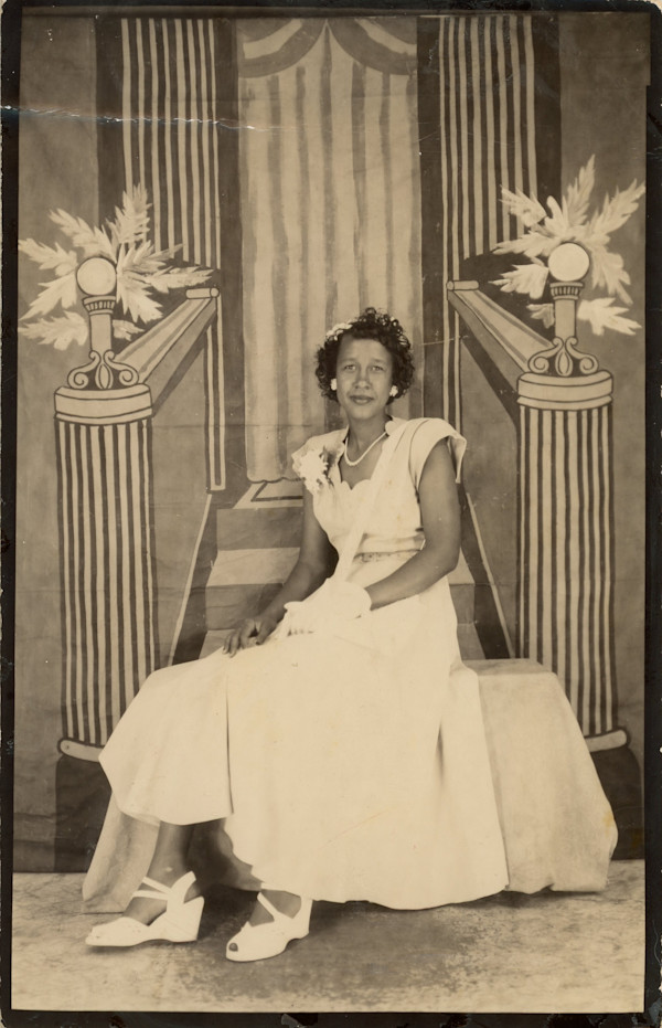 Woman with elegant throne backdrop by Unknown