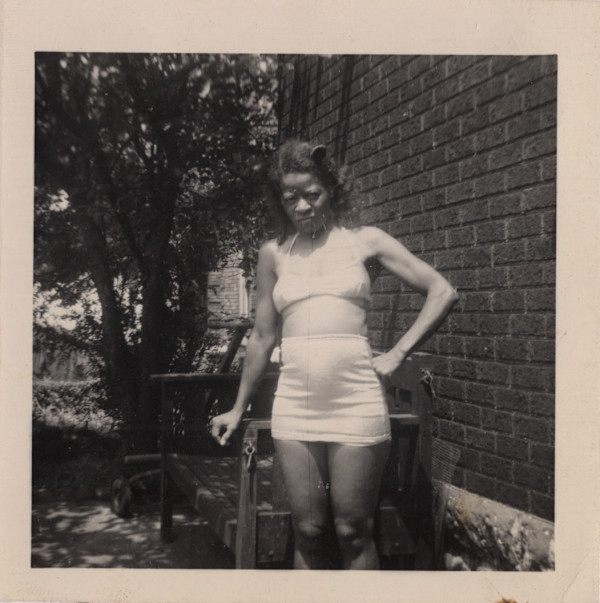 Slender woman in two-piece swimsuit by Unknown