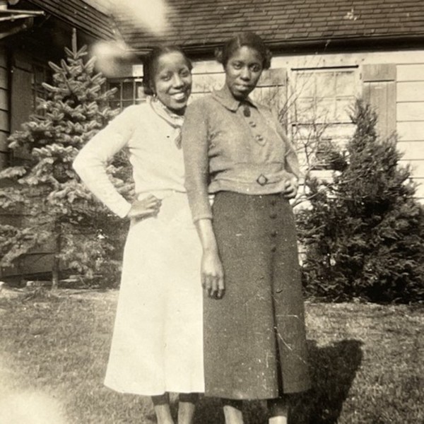 Two women standing close by Unknown