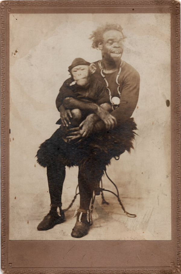 Wild Man holding monkey by Unknown