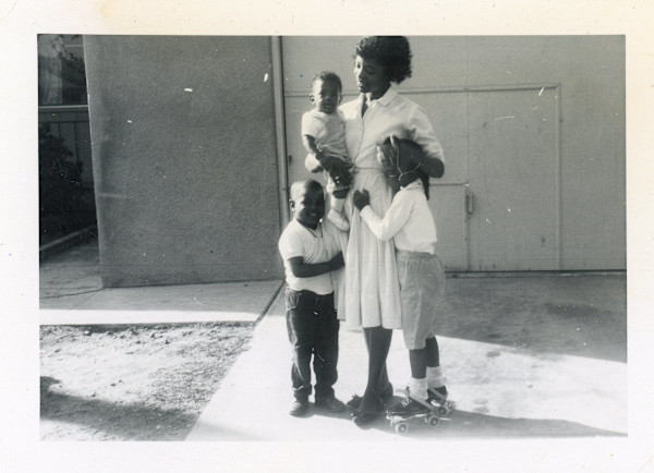 Woman with three children by Unknown