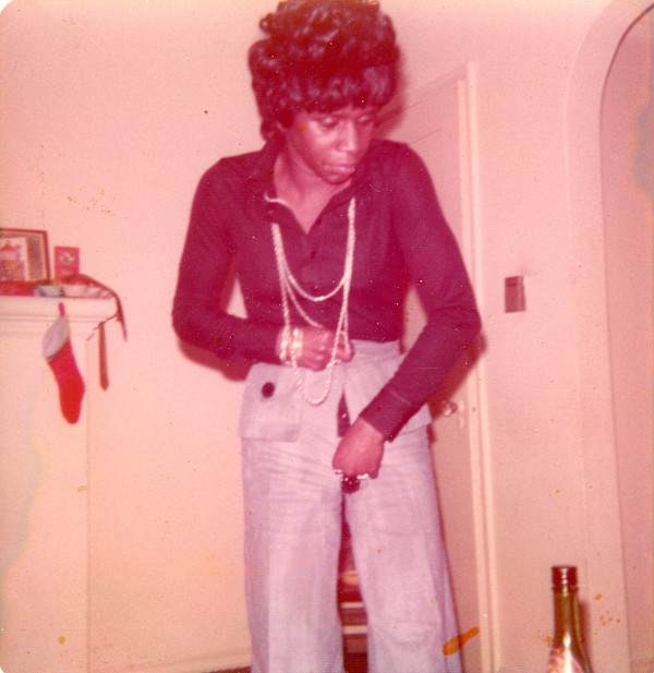 Woman zipping up pants by Unknown