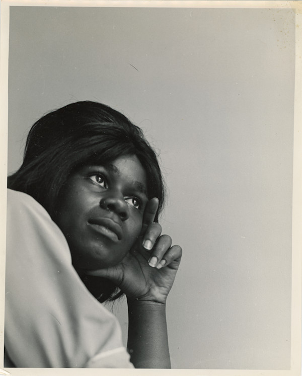 Young woman posing by Unknown