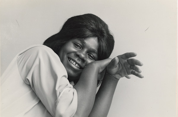 Young woman posing by Unknown