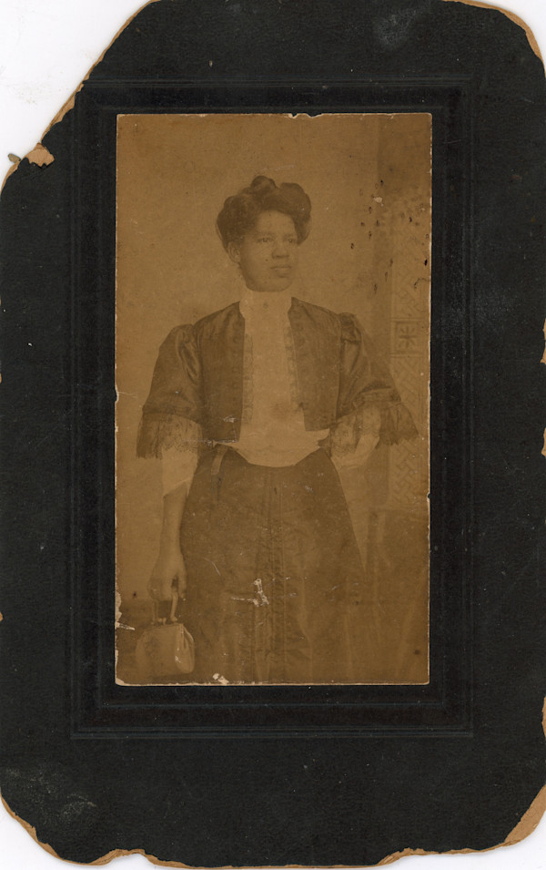 Woman in lace-trimmed jacket by Unknown