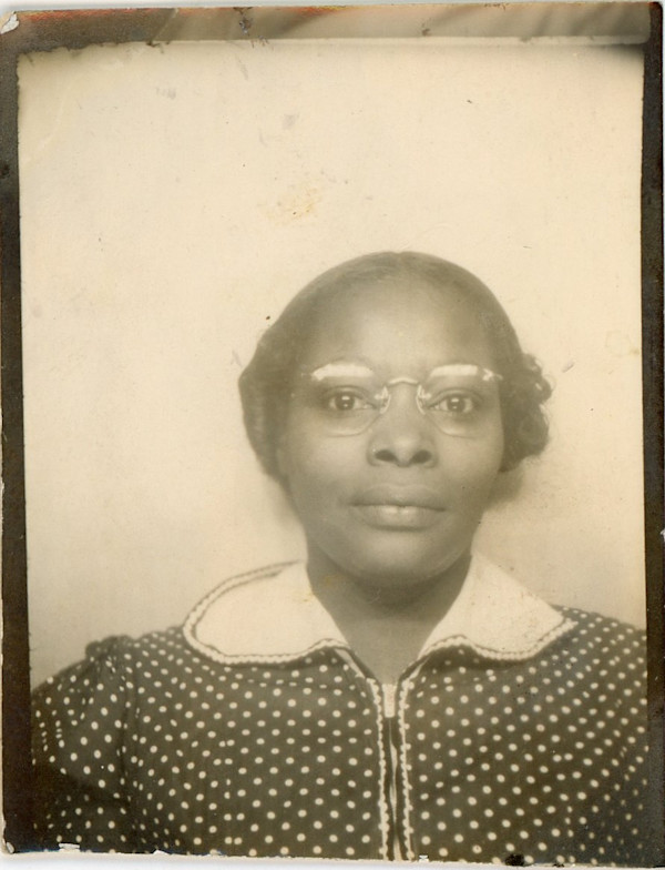 Woman in polka dot dress & eyeglasses by Unknown