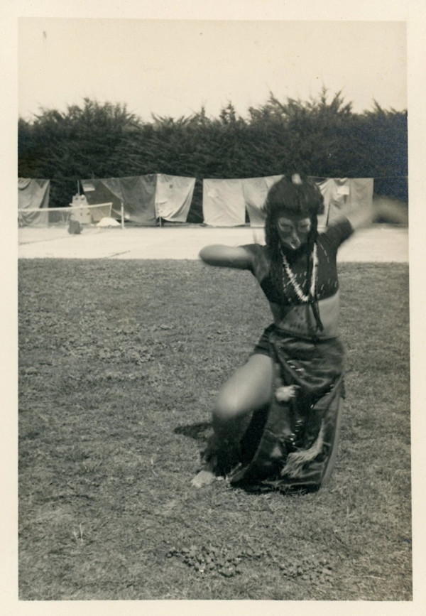 Woman dancing in mask by Unknown