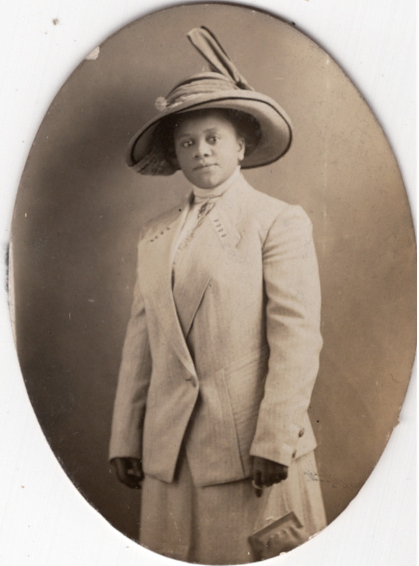 Woman in light suit by Unknown