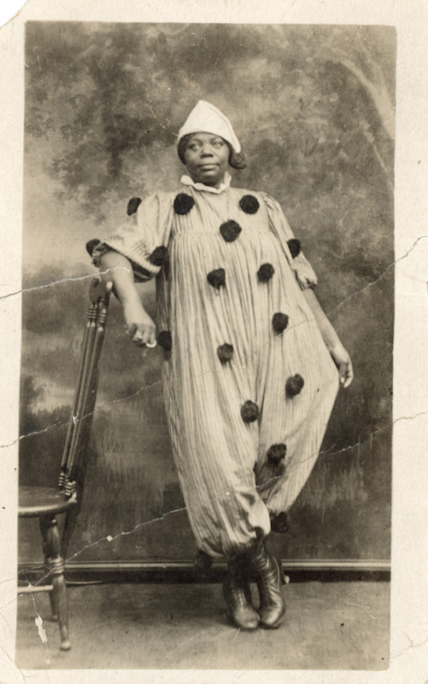 Woman in clown costume by Unknown