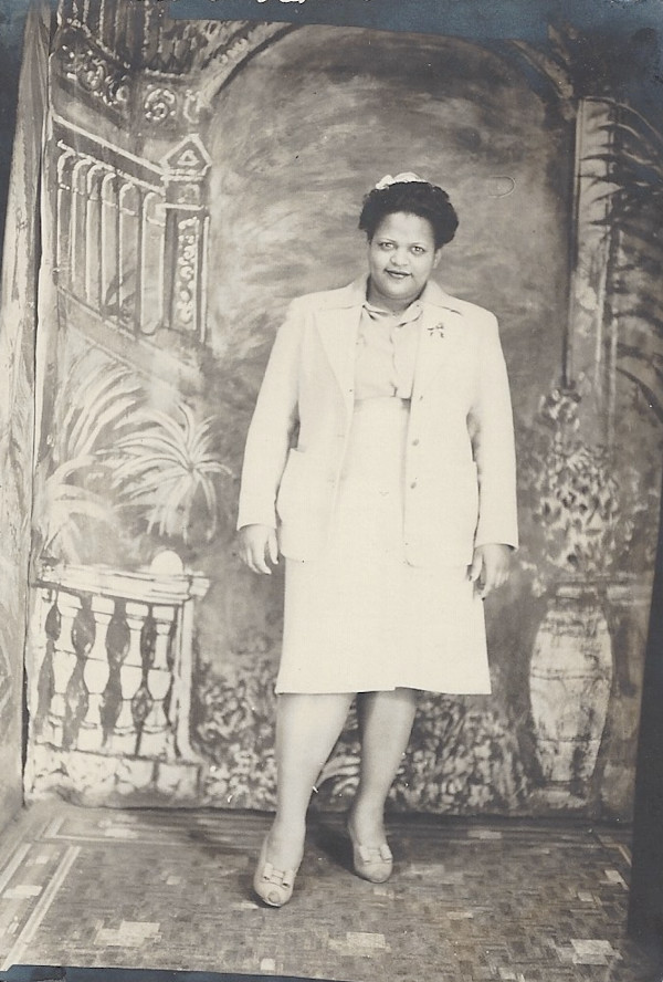 Woman in light-colored suit by Unknown