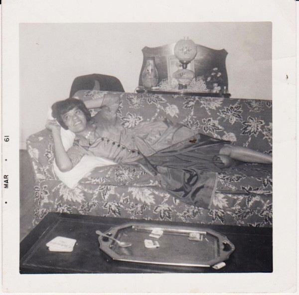 Reclining woman on sofa by Unknown