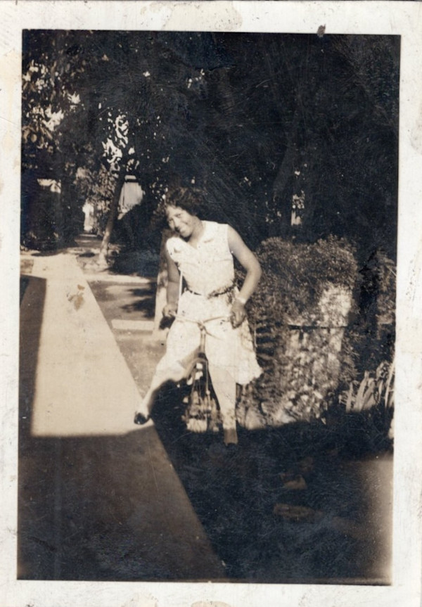 Woman with lawnmower? by Unknown