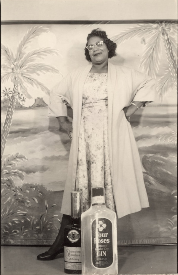 Woman with liquor bottles, Lake Charles, Louisiana by Unknown