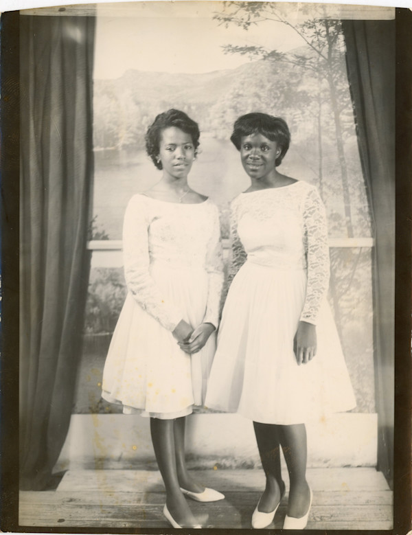 Two women with landscape backdrop by Unknown