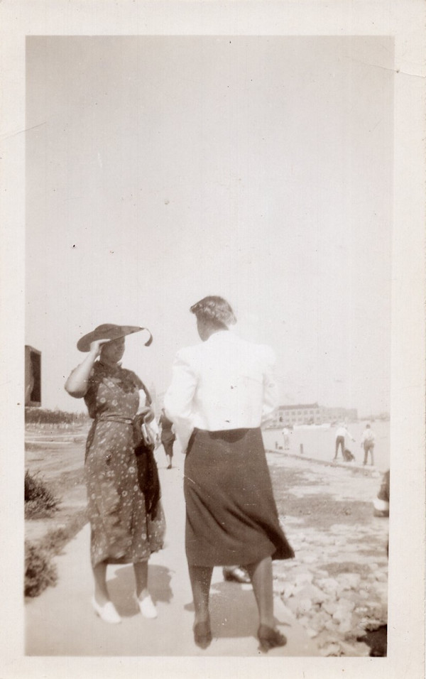 Two women on the beach boardwalk by Unknown