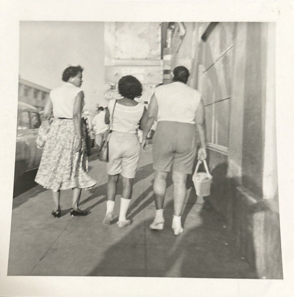 Three women walking by Unknown