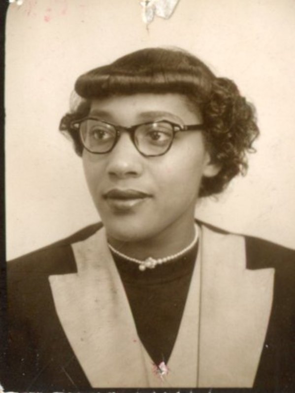 Young woman in glasses by Unknown