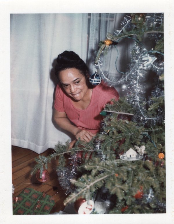 Woman with Christmas tree by Unknown