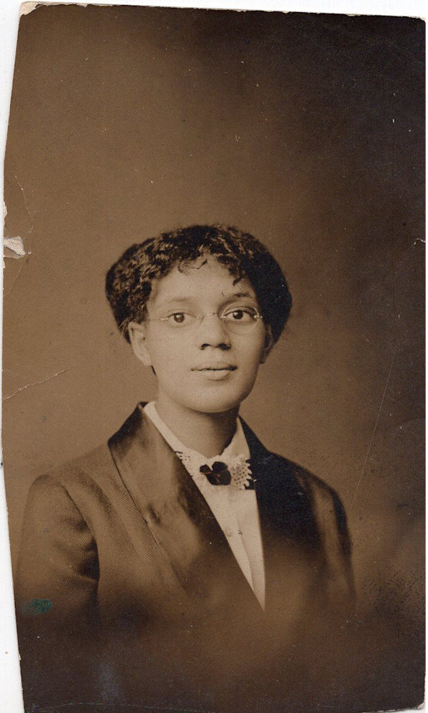 Young girl with glasses by Unknown